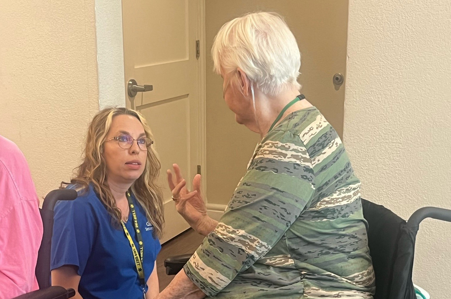 Jolie Kitzke talking to a resident