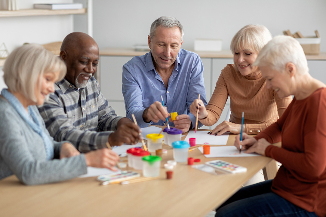 group of seniors enjoying painting